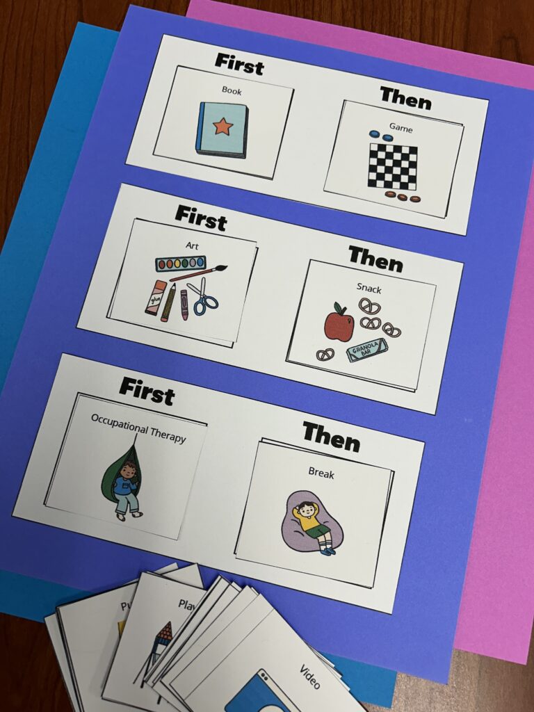 First-then board with daily task cards on desk.